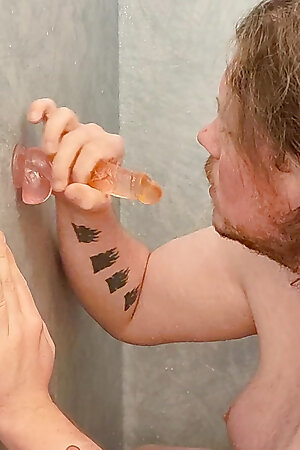 amateur sucks dildo in the shower