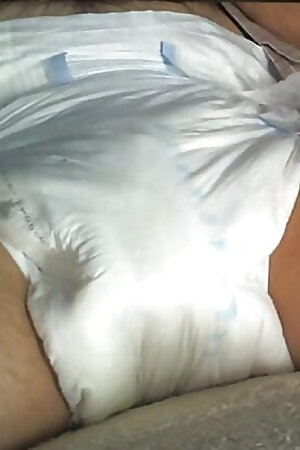 cock caged and filling the diaper
