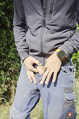 Young craftsman in Engelbert Strauss workwear pisses with his hard thick cock