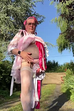 In an outfit with a pink nightgown and a white robe for an evening.