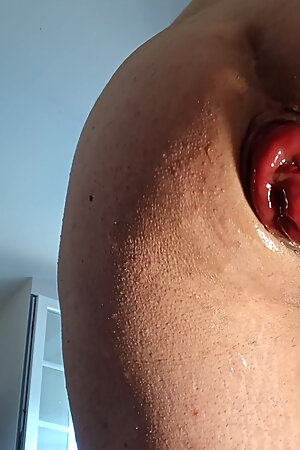 naked in front of the camera, he exposes his ass