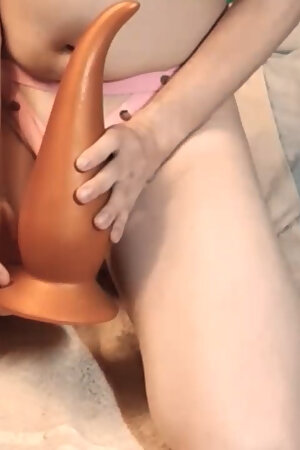 Young guy in chastity cage demonstrate all his anal toys