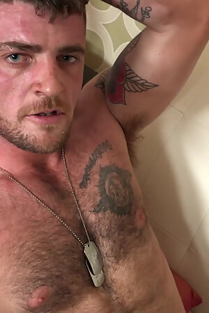 BondageBros: Tattooed Hunk Nick Blue Eyes tugs his veiny meat