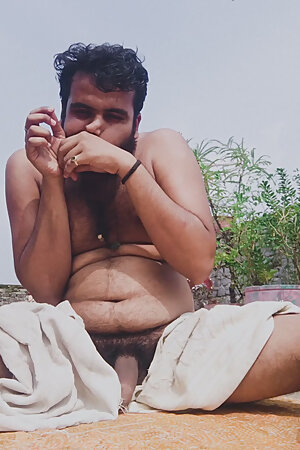 Ismaatdeva has playing with her hairy cock after body bath on terrace