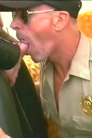 Muscular bear in leather chaps gets his cock slurped by police