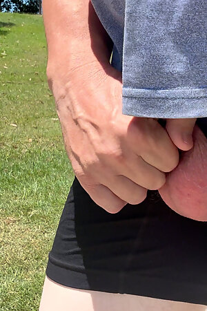 Straight guy out flashing his cock in the hot sun.