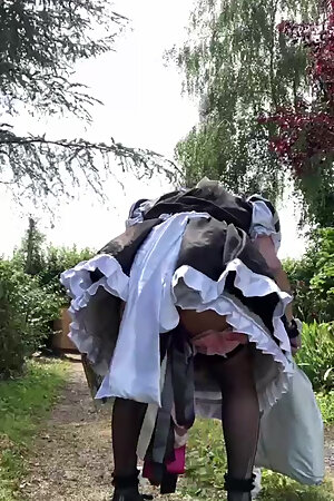 In a black and white maid outfit for a day