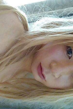 A cross-dressing boy wearing a white wedding dress masturbated comfortably while touching his dick with pink gloves.