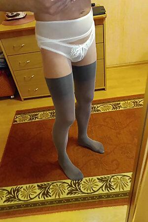 I'm wearing tights and panties and looking at myself in the mirror.