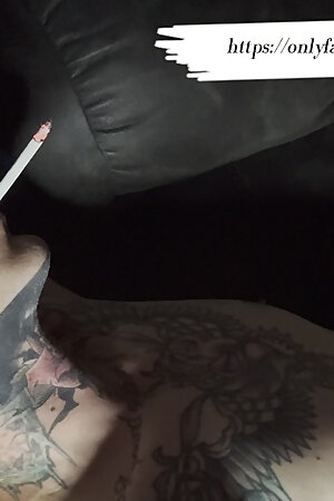 Tattooed Smoker Touches Himself