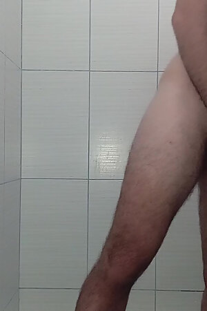 Hot guy with big cock does handjob in the shower